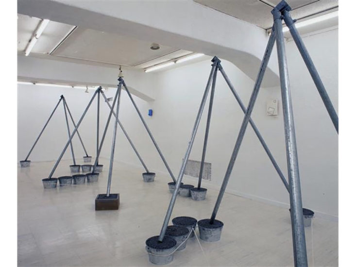 Suga Kishio,  The Cultivation of Mother Earth  (2000),  Steel pipes, buckets, wooden box, macadam, rope, 310 x 936 x (h) 228 cm  Photo by Tsuyoshi Satoh